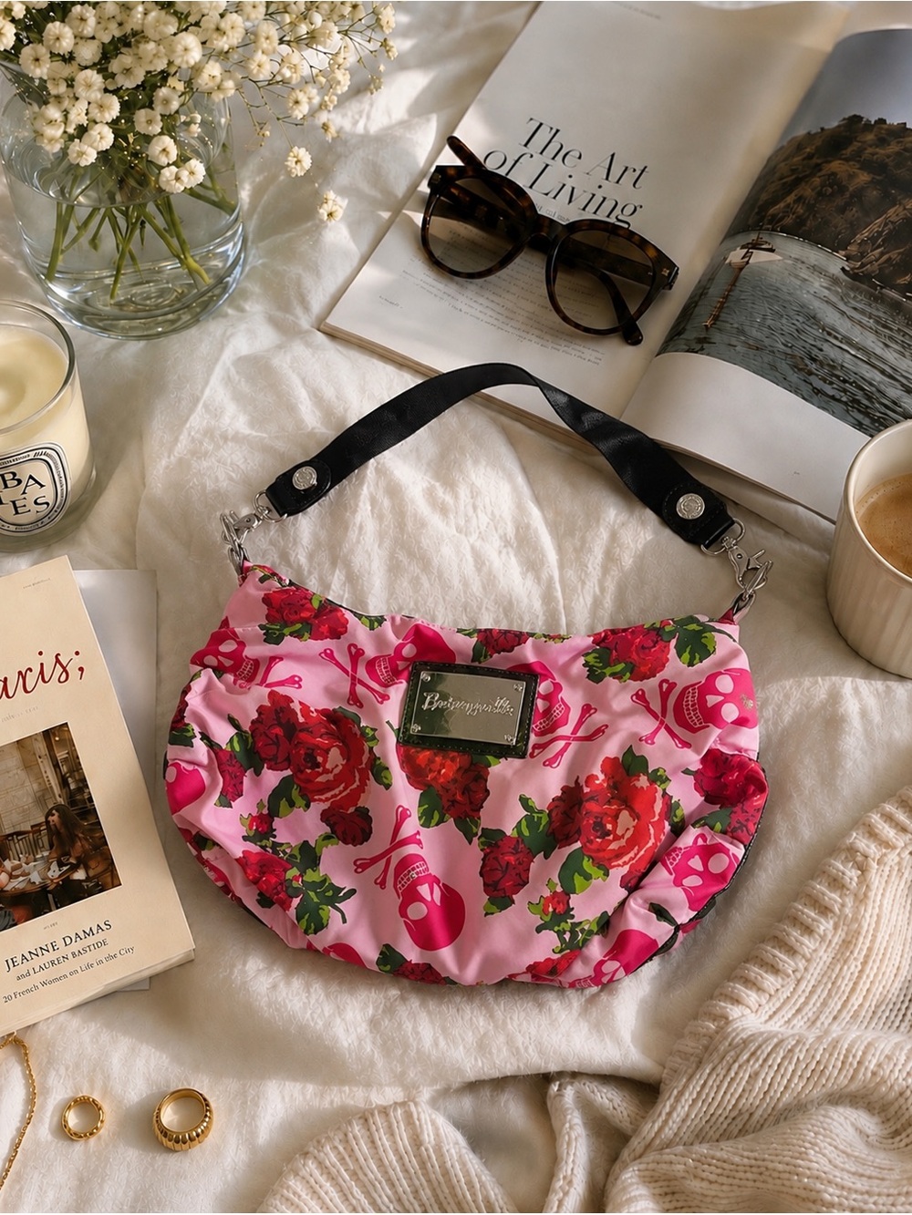 Rare Betseyville hobo bag features a vibrant skull and red rose print